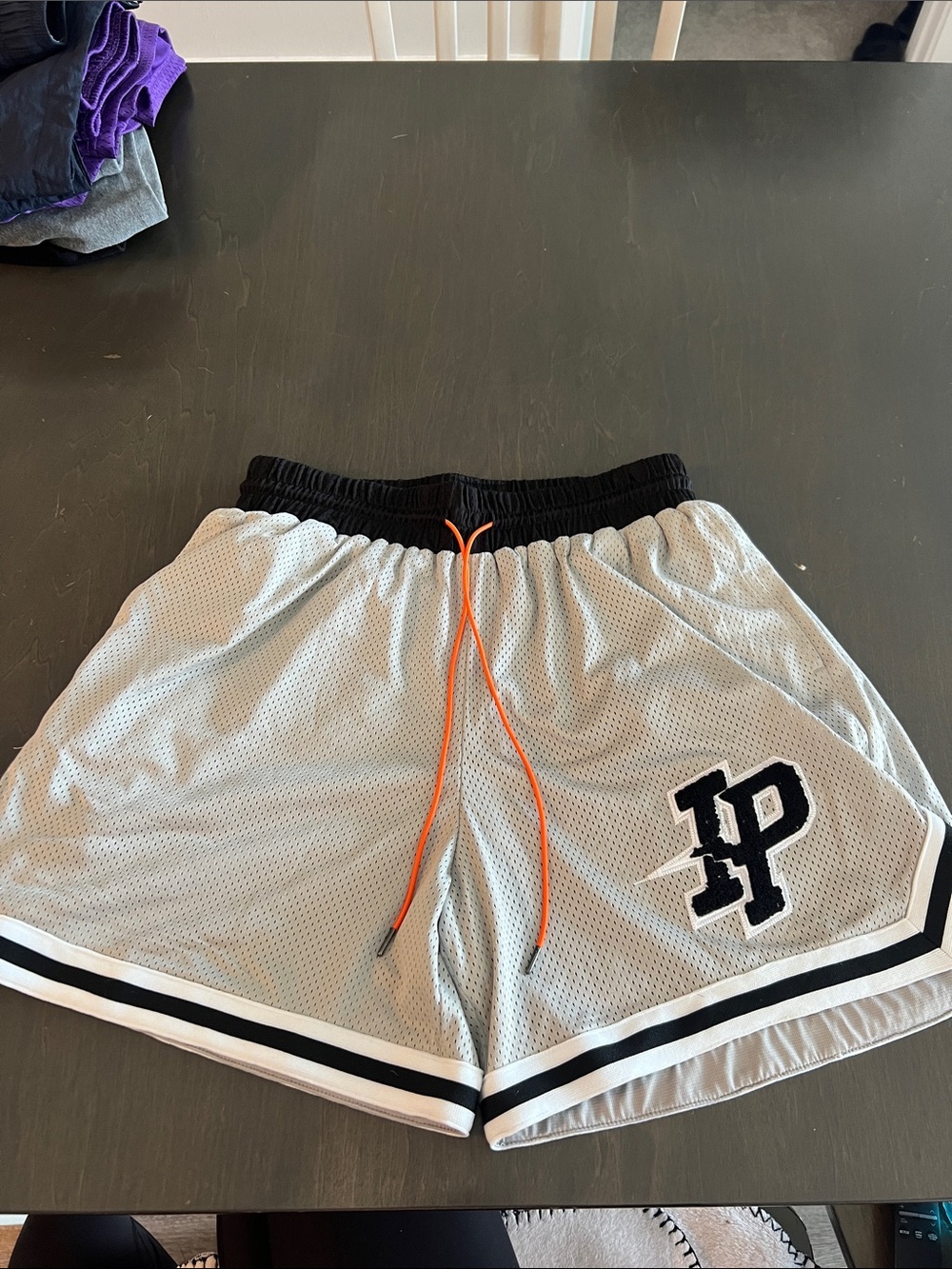 Gray Mesh Women's Athletic Shorts with Black Trim and Orange Drawstring